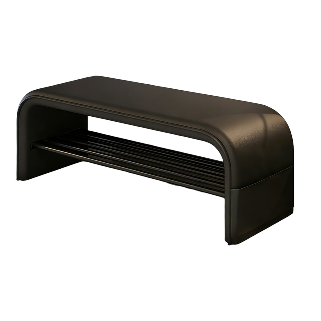 Black curved entryway bench with upholstered surface and integrated storage shelf