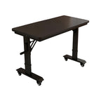 Black mobile height adjustable table with wheeled base for flexible office spaces