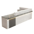 Left high return grey marble look  reception desk with fluted detail for commercial reception spaces