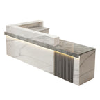 Right high return grey white marble look reception desk with fluted detail for commercial reception spaces