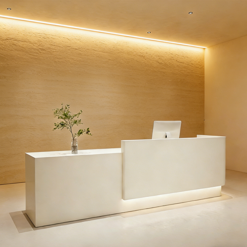 Minimalist reception counter featuring curved edges and illuminated base design