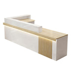 Right high return marble reception desk showing fluted panel and structured workstation area