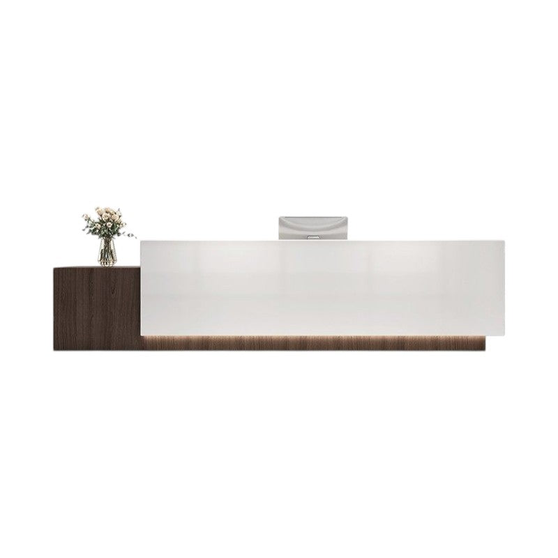 Dark walnut finish reception desk with LED lighting for modern commercial spaces